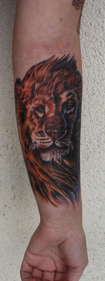 Ty McEwen - lion tattoo